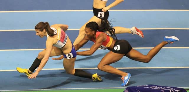 Seren Bundy-Davies and Margaret Adeoye crash out of a dramatic womens 400m final. Picture: PA
