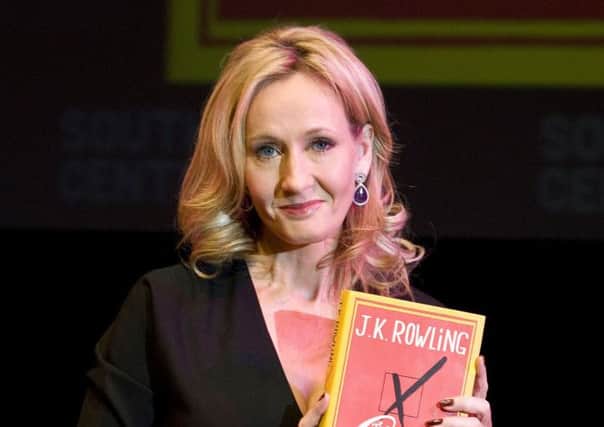 JK Rowling holding her novel The Casual Vacancy. Picture: PA