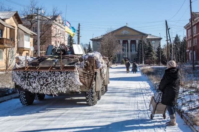 Ukrainian forces pass through the town of Myronivskyi, in eastern Ukraine, yesterday. Picture: Getty