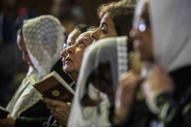 Egyptian Coptic women attend a mass to honor the memory of the Egyptians murdered by IS militants in Libya. Picture: Getty