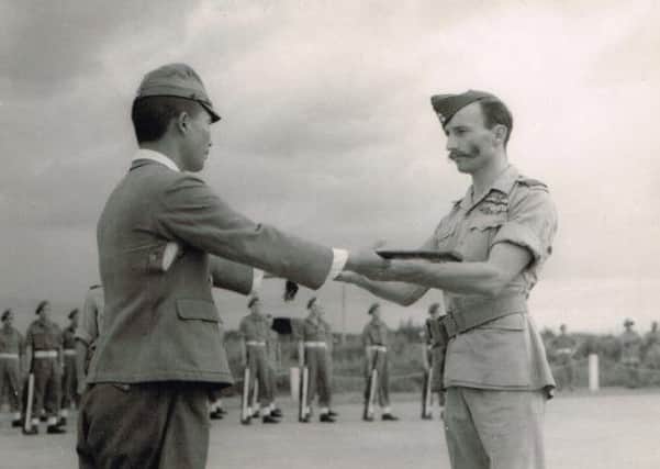 Squadron Leader Walter Hibbert receiving the surrender of a Japanese squadron in Saigon