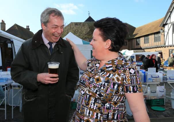 Nigel Farage enjoys a beer during a walkabout in Sandwich. Picture: PA