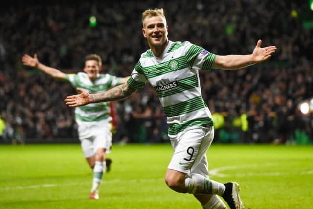 John Guidetti celebrates after netting a last-gasp equaliser for Celtic. Picture: SNS