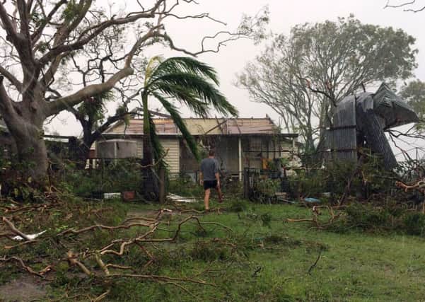 A man heads for his badly damaged home in Yeppoon after Cyclone Marcia hit. Picture: Getty