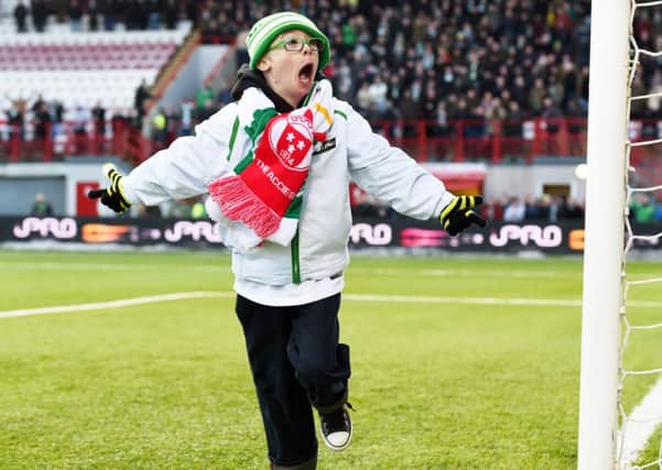 Young Celtic fan Jay Beatty celebrates after scoring during the Hamilton v Celtic match. Picture: SNS