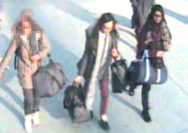 CCTV shows the un-named 15-year-old, Kadiza Sultana,16 and Shamima Begum,15 at Gatwick airport. Picture: PA
