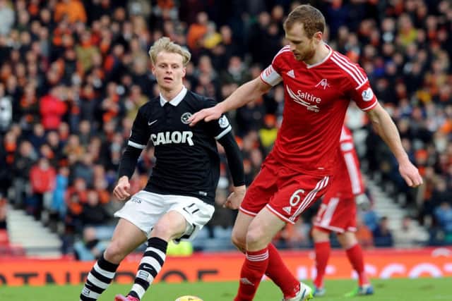 Aberdeen centre-back Mark Reynolds, right, sticking to 'one game at a time' mantra. Picture: Lisa Ferguson