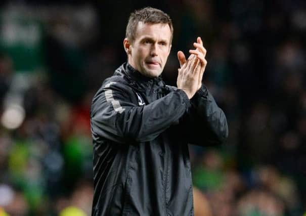 Ronny Deila applauds the Celtic fans at the end of Thursday's match. Picture: SNS