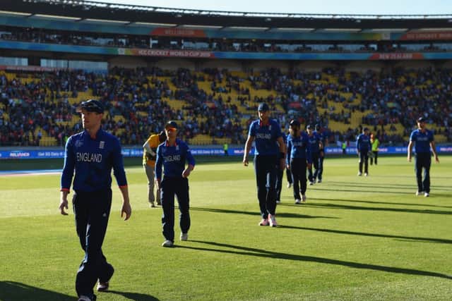 A shell-shocked captain Eoin Morgan leads his bedraggled team off the pitch. Picture: Getty