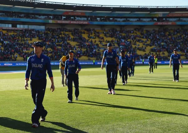 A shell-shocked captain Eoin Morgan leads his bedraggled team off the pitch. Picture: Getty