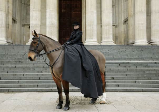 A model sits upon a horse at St Paul's Cathedral following memorial service of Louise Wilson. Picture: PA