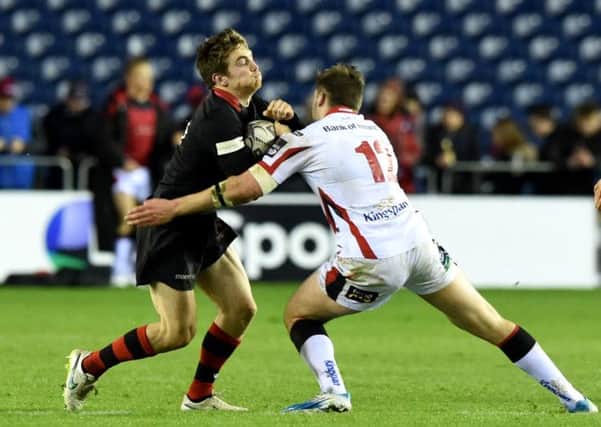 Tom Heathcote (left) faces a challenge from Ulster's Stuart McCloskey. Picture: SNS