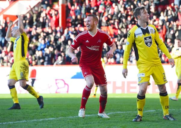 Aberdeen's Adam Rooney (centre) celebrates after putting his side 2-0 up. Picture: SNS Group