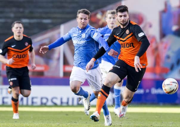Nadir Ciftci (right) tries to break free of St Johnstone's Chris Millar. Picture: SNS Group
