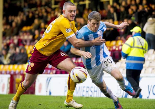 Motherwell's Louis Lang (left) battles with Jim McAlister. Picture: SNS Group