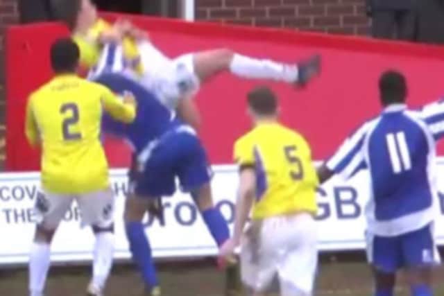 Ouch: Shabir Khan bodyslams Charlie Russell. Picture: YouTube