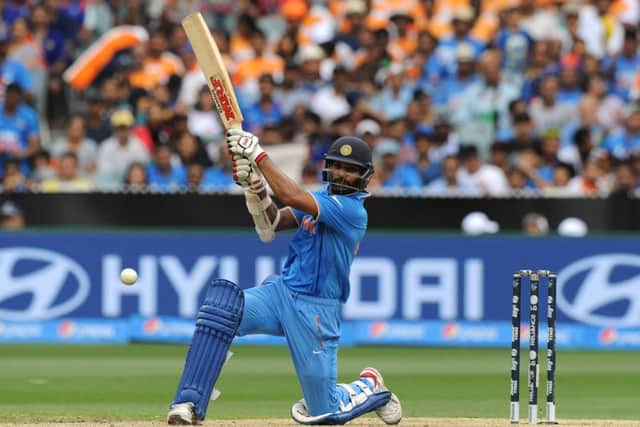 India batsman Shikhar Dhawan hits out on his way to a century in a one-sided contest at the MCG. Picture: AFP/Getty
