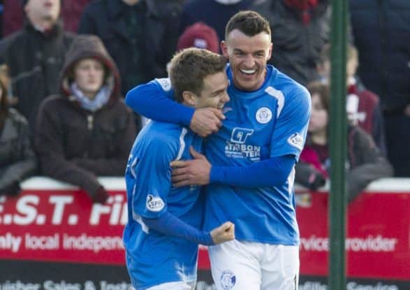 Derek Lyle, right, congratulates Danny Carmichael after his goal against Hearts on Saturday. Picture: SNS