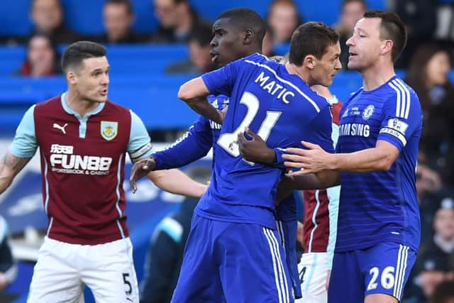Nemanja Matic rages after being caught by Ashley Barnes. Picture: AFP