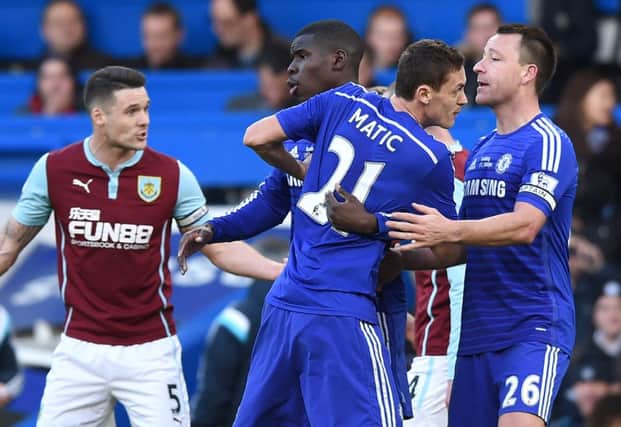 Nemanja Matic rages after being caught by Ashley Barnes. Picture: AFP