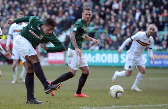 Dominique Malonga fires home his second and Hibs' third goal. Picture: Neil Hanna