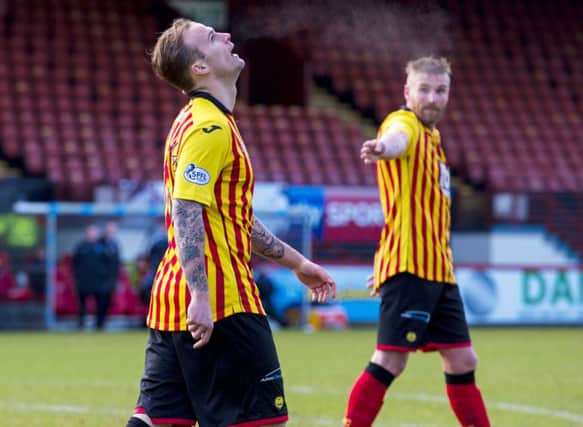 Partick Thistle's Kallum Higginbotham shows his anguish after missing a penalty. Picture: SNS