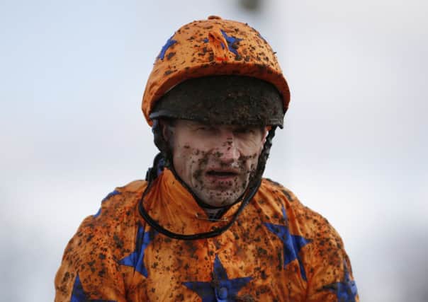 It was mud, glorious mud at Plumpton yesterday as rider Andrew Thornton quickly found out. Picture: Getty