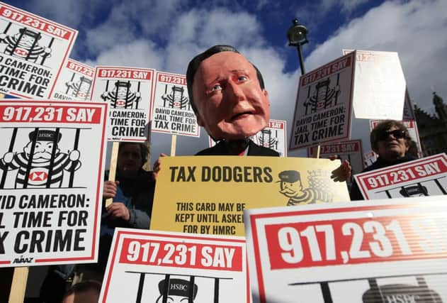 Avaaz organised a demonstration against tax evasion outside the House of Commons yesterday. Picture: PA