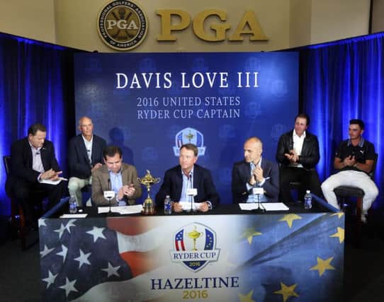 Davis Love III, centre, receives applause during the media conference to announce his captaincy. Picture: AP