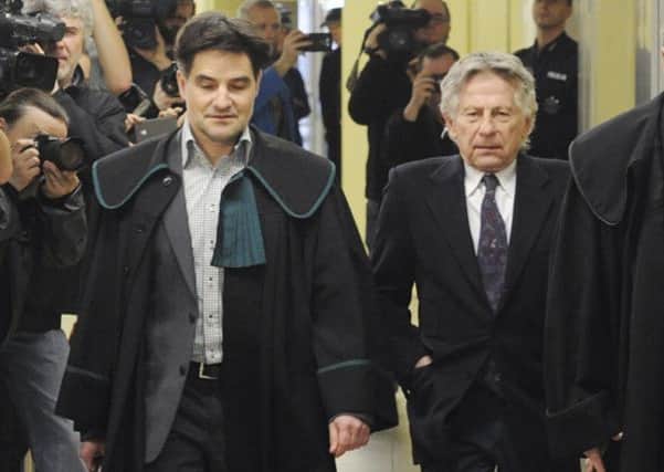Roman Polanski, right, and one of his lawyers yesterday. Picture: AP