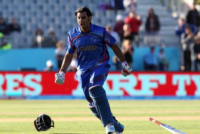 Shapoor Zadran of Afghanistan celebrates the win. Picture: Getty