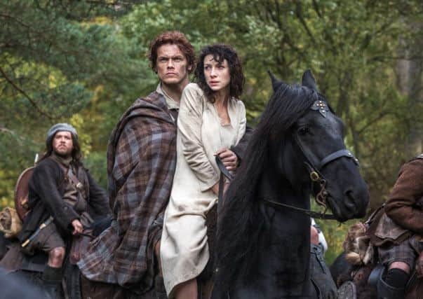 Caitriona Balfe as Claire Randall, right, and Sam Heughan as Jamie Fraser. Picture: AP