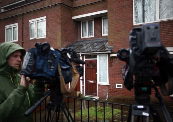 A camerman positioned outside the home where Mohammed Emwazi is believed to have once lived. Picture: Getty