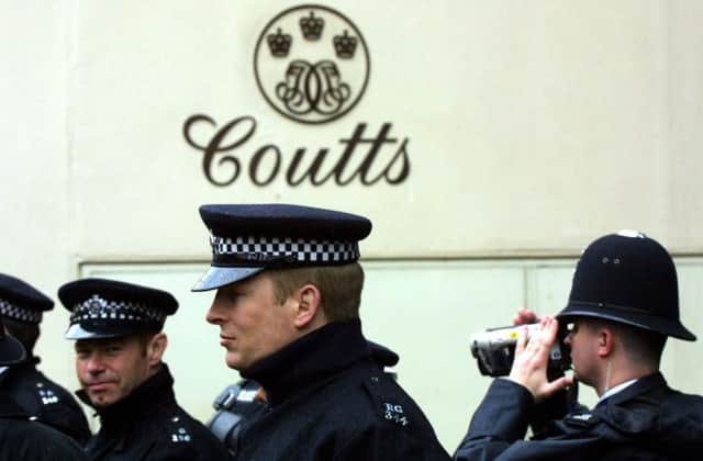 Police guard Coutts bank in London at a past protest against the rich. Picture: Getty