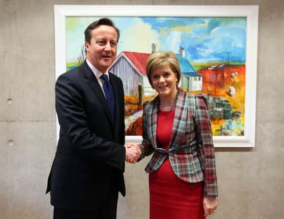 Its an unlikely scenario, David Cameron or Ed Miliband courting Nicola Sturgeon. Picture: Getty