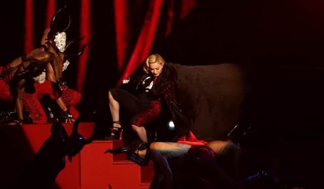 Madonna has revealed she suffered whiplash when she took a tumble on stage. Picture: PA