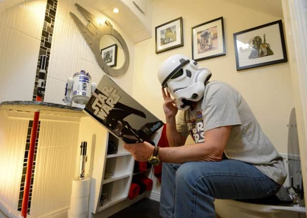 Star Wars fan Eric Blair in his Star Wars toilet. Picture: SWNS
