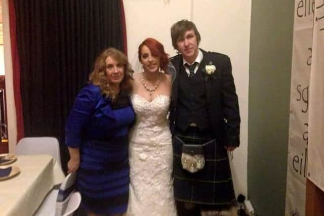 Cecilia Bleasdale (left)  in THE dress with newlyweds Grace and Keir Johnston on Colonsay. Picture: Hemedia
