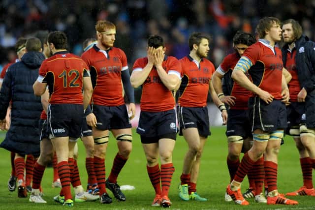 Scotland's Matt Scott (centre) dispondent after Scotland's defeat. Picture: Jane Barlow