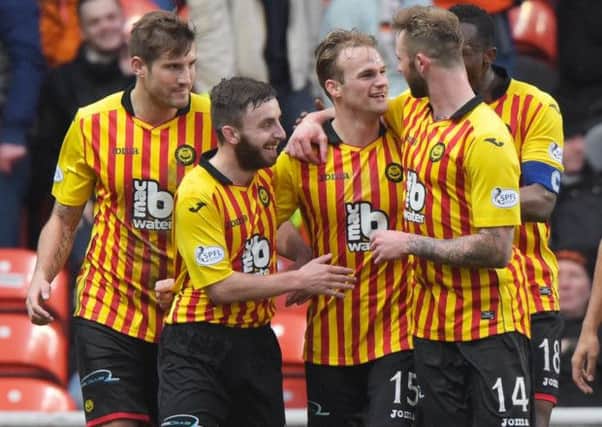 Partick Thistle's Kallum Higginbotham (3rd from right) celebrates with his team-mates. Picture: SNS Group