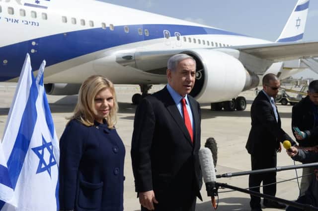 Mr Netanyahu and wife Sarah leave Tel Aviv yesterday to travel to Washington. Picture: Getty