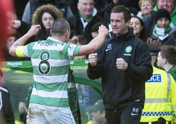 Celtic captain Scott Brown celebrates with manager Ronny Deila at full-time. Picture: SNS