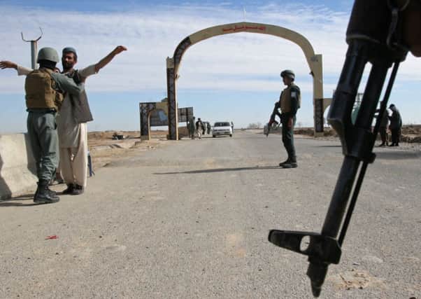 Afghan troops out in force at a checkpoint in Helmand. Picture: AP