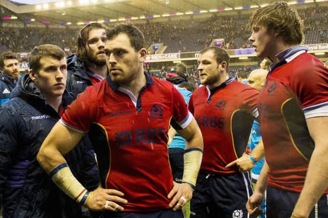 Dejected Scotland players at the end of Saturdays dramatic defeat. Picture: SNS