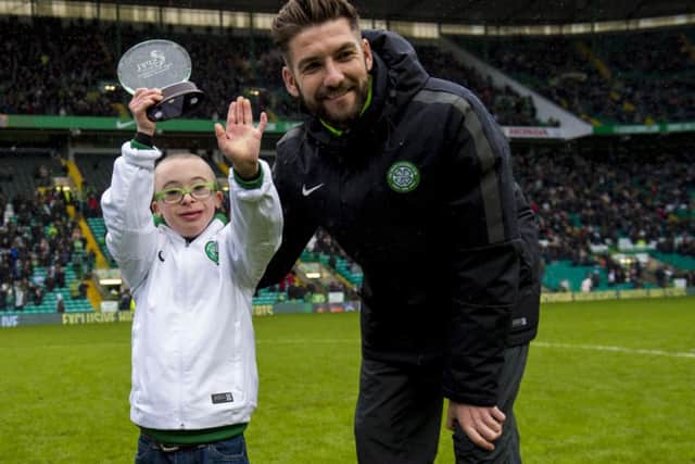 Jay Beatty is presented his SPFL Goal of the Month award by Charlie Mulgrew. Picture: SNS