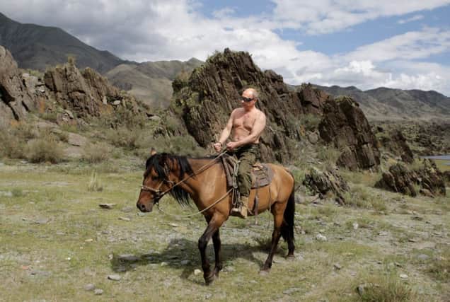 Vladimir Putin, like Benito Mussolini, below, likes posing for photographs while engaged in manly pursuits. Picture: Getty