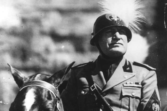 Italian dictator Benito Mussolini in military uniform, steel-helmeted and riding a horse. Picture: Getty