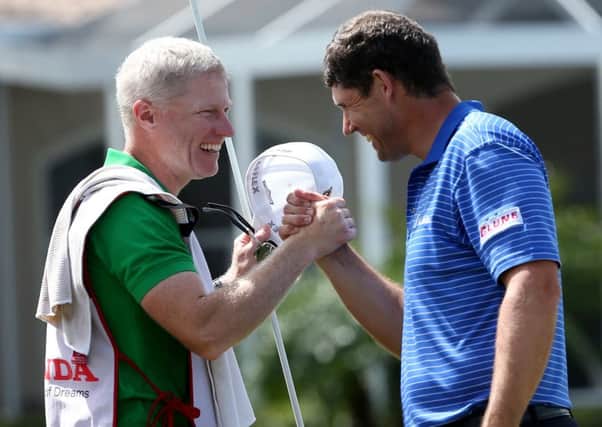 Padraig Harrington, right, celebrates with his caddie after winning the Honda Classic. Picture: Getty