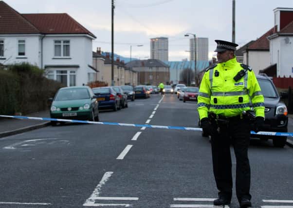 Police outside Holyrood Secondary School in Glasgow where a teenager was taken to hospital after being stabbed. Pic: HEMEDIA