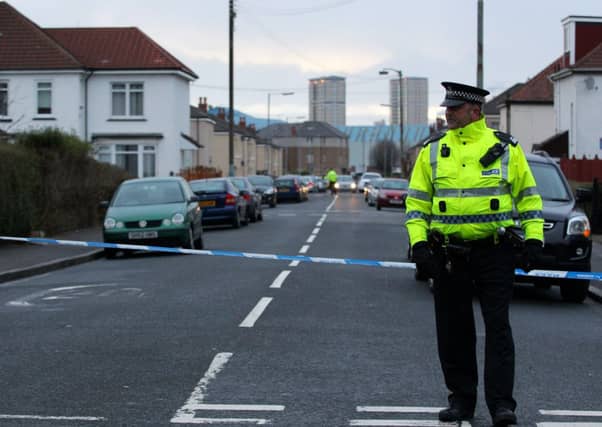 Police outside Holyrood Secondary School in Glasgow where a teenager was taken to hospital after being stabbed. Pic: HEMEDIA